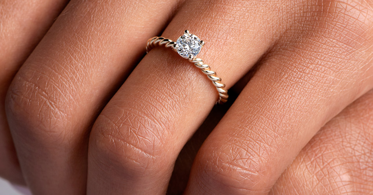 A lady wearing a newly made solitaire ring