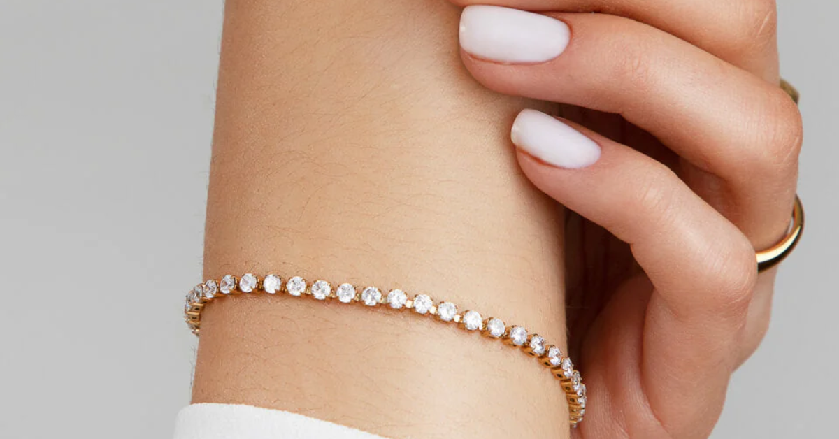 A lady wearing a thin tennis bracelet on her wrist