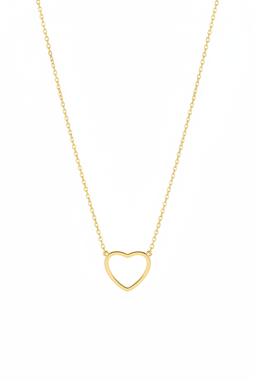 Gold heart necklace on white background