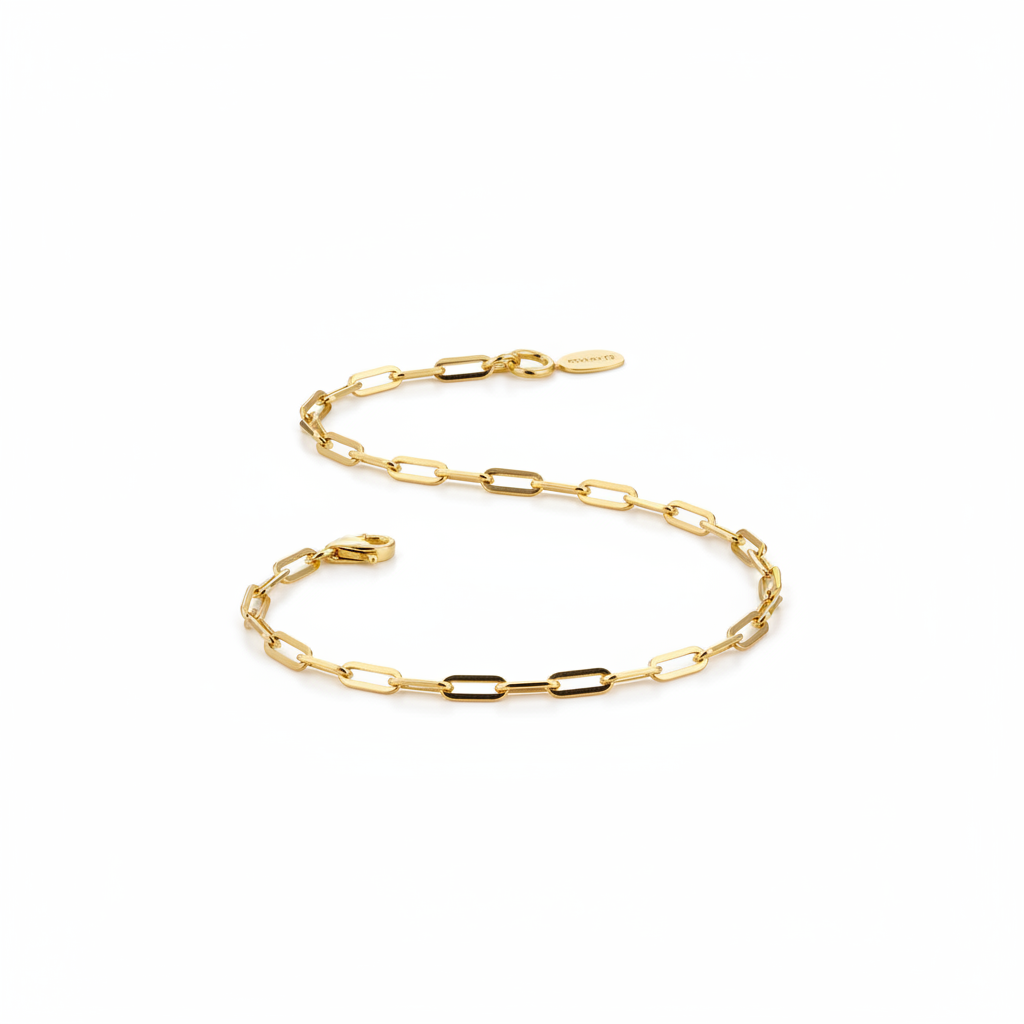 Gold paperclip bracelet on white background