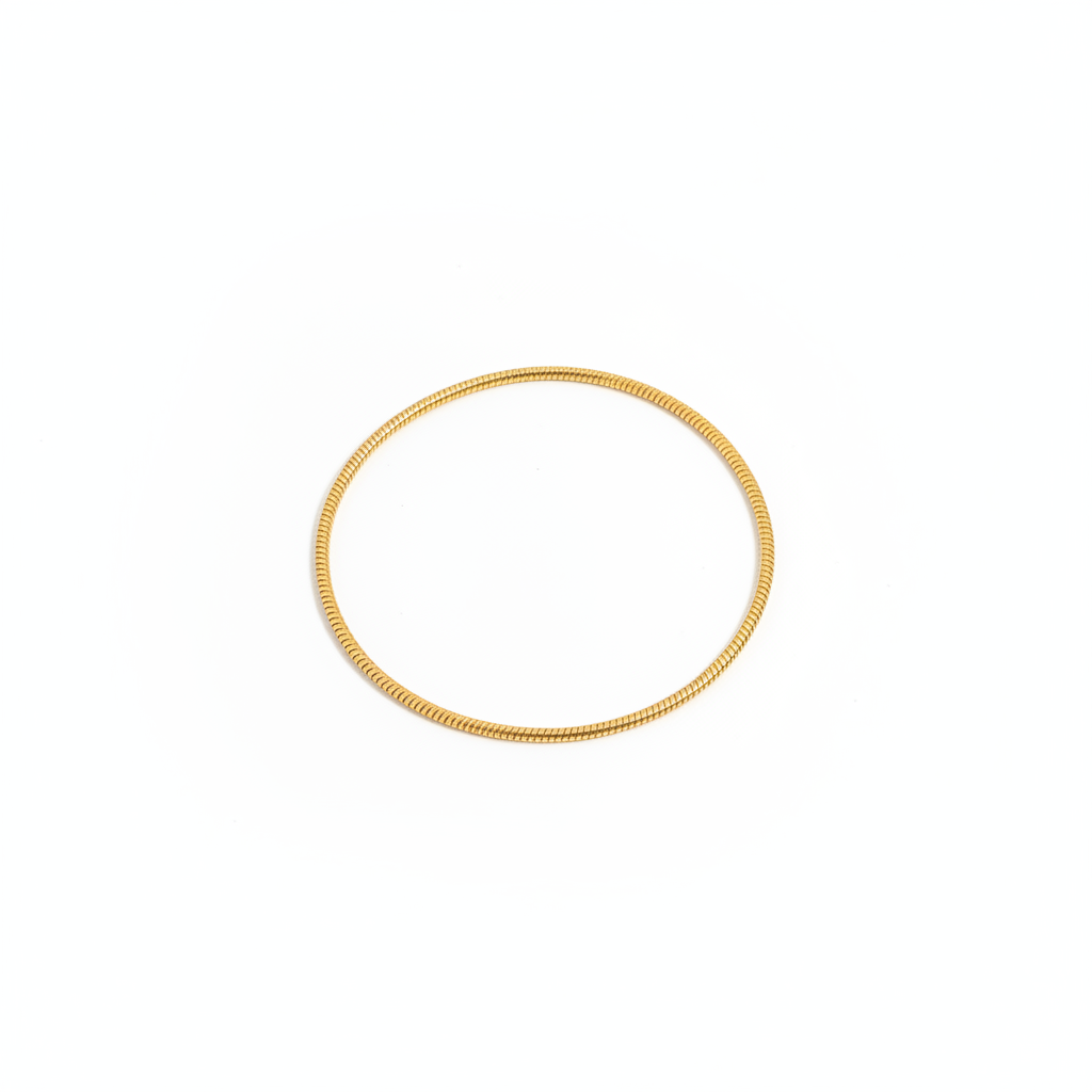 Gold snake chain bracelet on white background