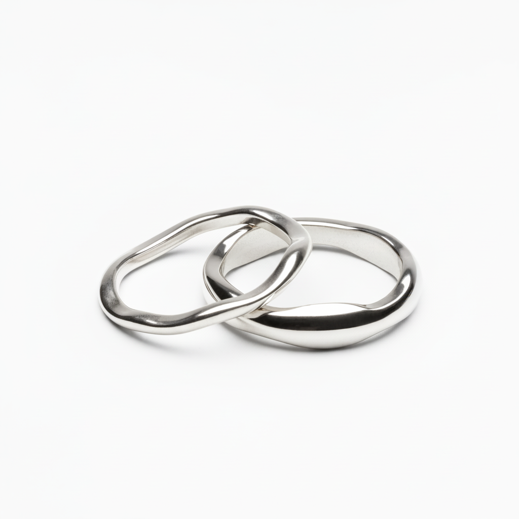 Two silver stackable rings on pure white background